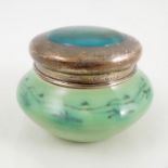 A Ruskin pottery covered dressing table pot, of circular form,