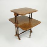 An Edwardian burr walnut two tier Sutherland table, with turned columns and outsplayed legs,