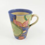 A Clarice Cliff mug, decorated in the Fantasque Chintz pattern from the Bizarre range, height 3.