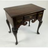 An 18th century oak low boy,