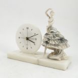 A white marble mantel clock, the rectangular base with circular dial having a quartz movement,