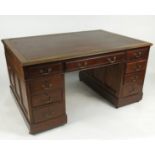 A double sided mahogany partners' desk, having one long and two short drawers to each side,