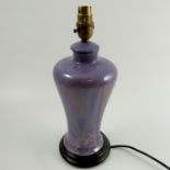 A Ruskin Pottery lamp base, of baluster form, decorated in a purple lustre glaze, dated 1916,