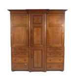 A late Georgian oak Shropshire cupboard dresser, of break front outline,