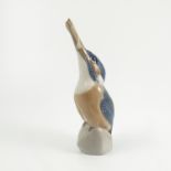 A Royal Copenhagen model, of a Kingfisher sitting on a rock with a fish in its beak,