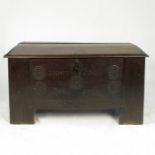 An antique oak domed top continental chest,