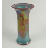 A Ruskin Pottery vase, of trumpet form, decorated in a pale blue and red high fire lustre glaze,