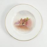 A Royal Worcester dish, decorated with a view of Edgar Tower Worcester, dated 1925, diameter 5.