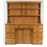 A 19th century pine dresser, with associated pine delft rack over,