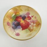 A Royal Worcester pin dish, hand painted with Autumnal fruits and berries by Kitty Blake,