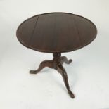 A Georgian design mahogany dish top occasional table, raised on tripod base,