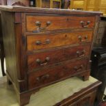 A mahogany chest, of four long drawers, with column ends, raised on bracket feet, width 29.