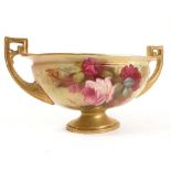 A Royal Worcester oval pedestal bowl, with a pair of gilt handles,