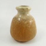 A Ruskin Pottery vase, of bulbous form, decorated in an orange crystalline glaze, height 6.