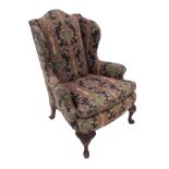 A Georgian design wing armchair,