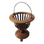 A low circular jardiniere stand, with slatted sides raised on a circular base,