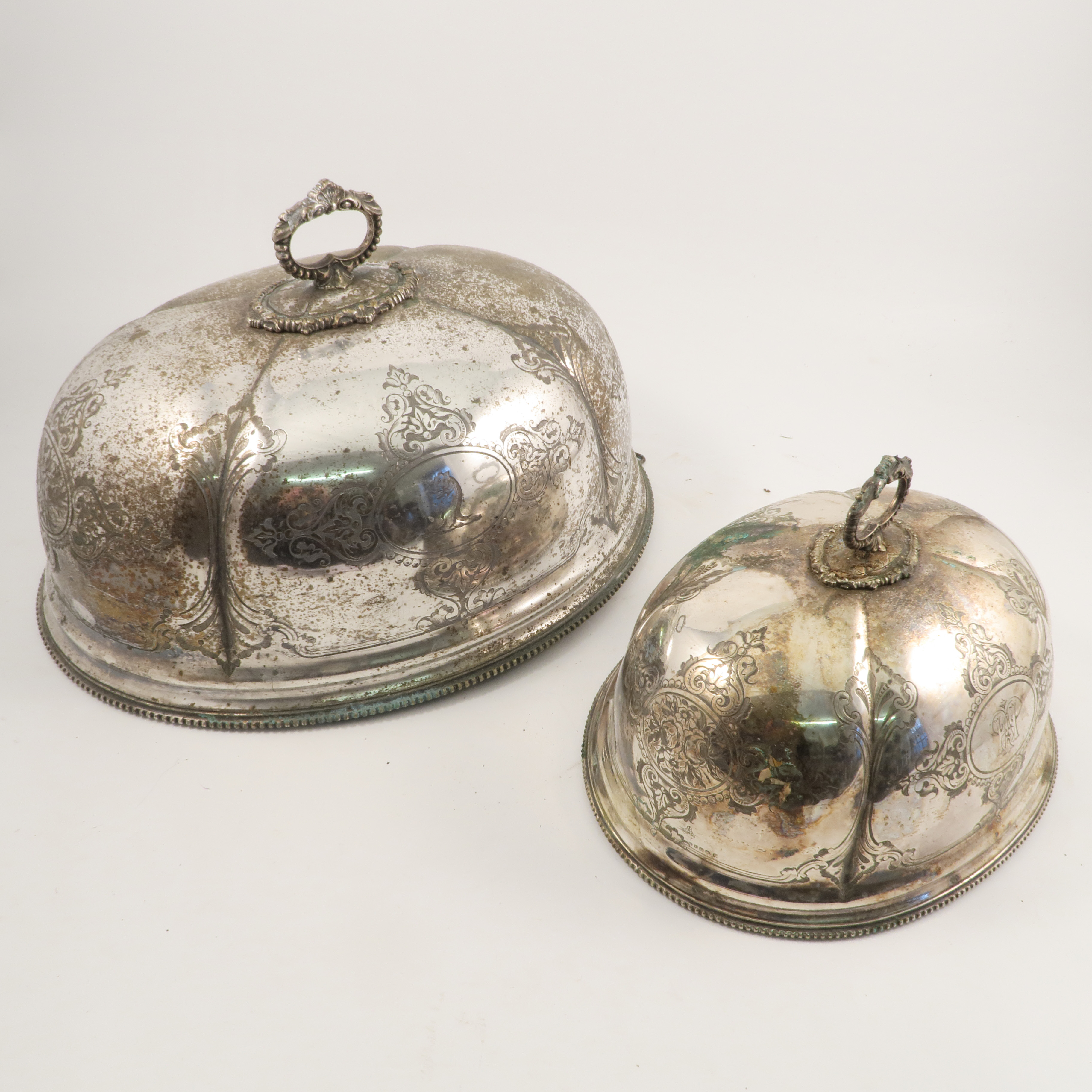 A silver plated meat dome, with engraved decoration, initials and crest, diameter 20.