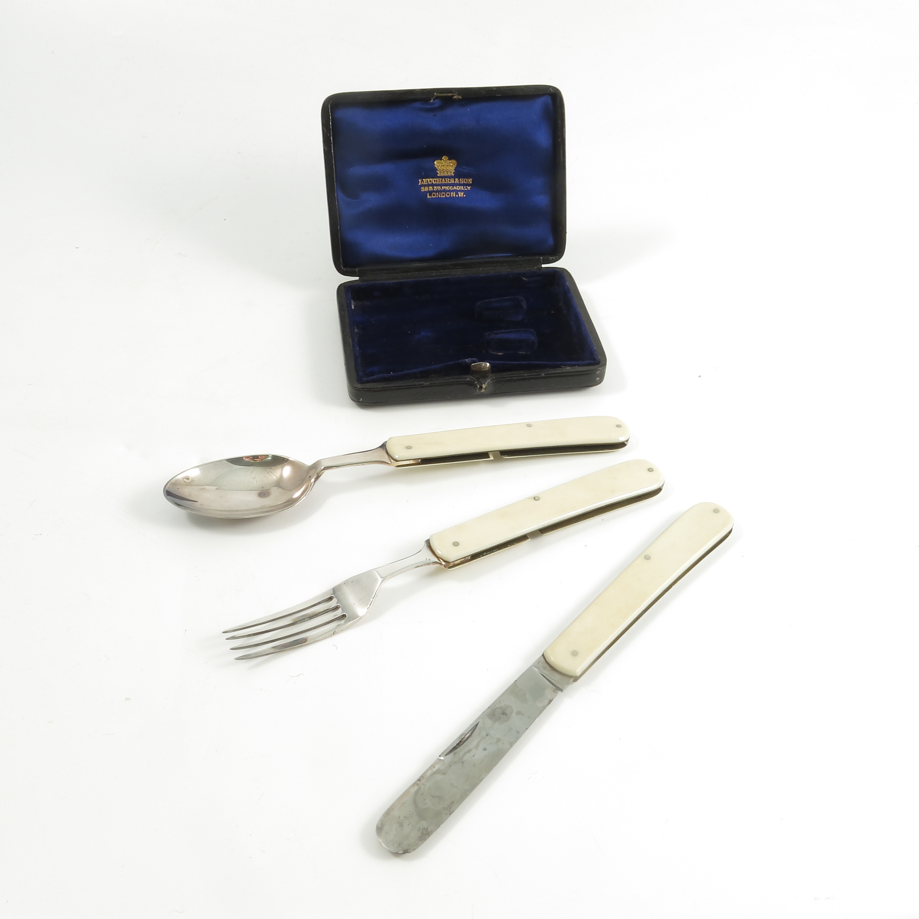 A cased set of 19th century silver plated and ivory handled folding cutlery, comprising a spoon,