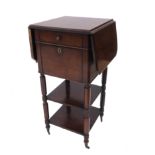 A rosewood bedside cabinet, with two drop flaps, drawer and cupboard, above two shelves,