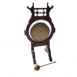 An Edwardian oak dinner gong, in the Eastern style,