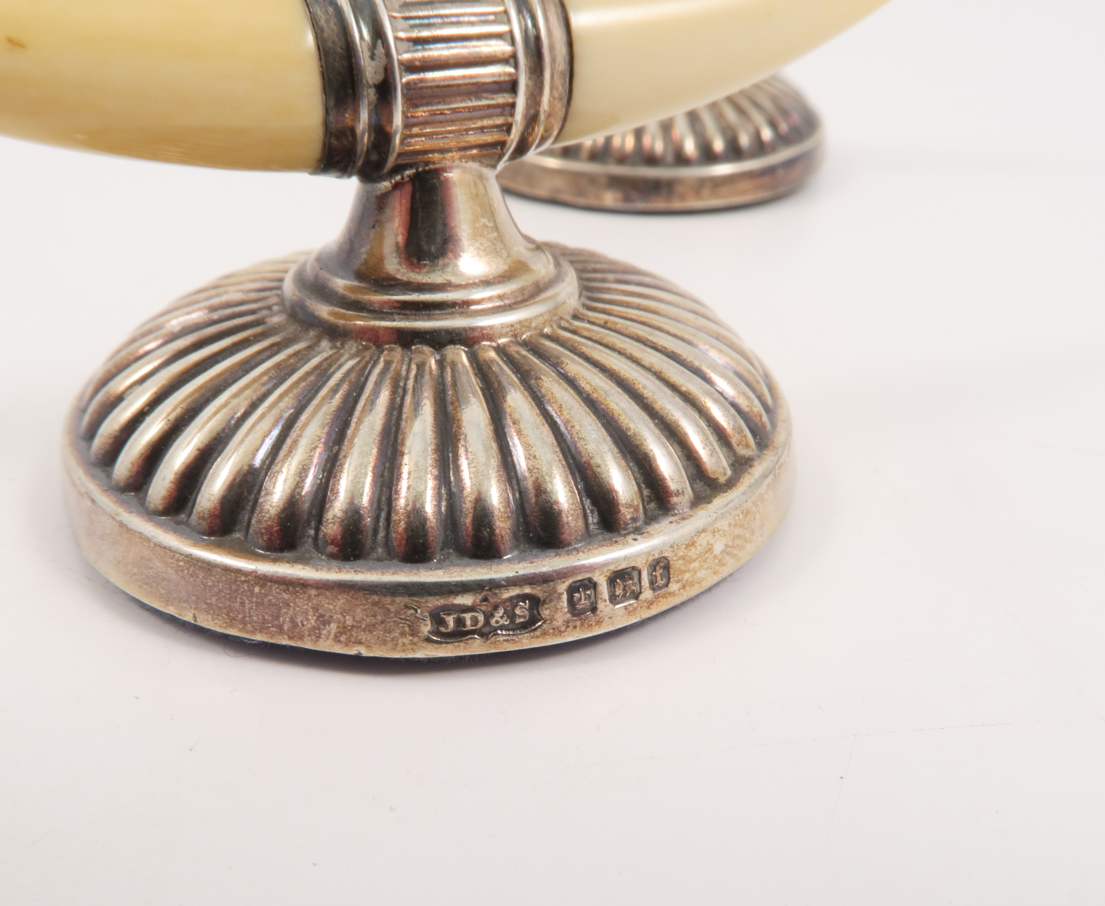 A pair of ivory and silver mounted knife rests, with embossed gadrooning to the silver, - Image 2 of 2