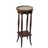 An octagonal marble topped plant stand,