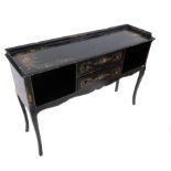 A small low ebonised cabinet, fitted with two central drawers flanked by open shelves,