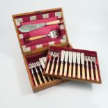 A 19th century twelve piece fish set, the knives and forks with engraved blades and tines,