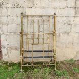 A brass single bed,