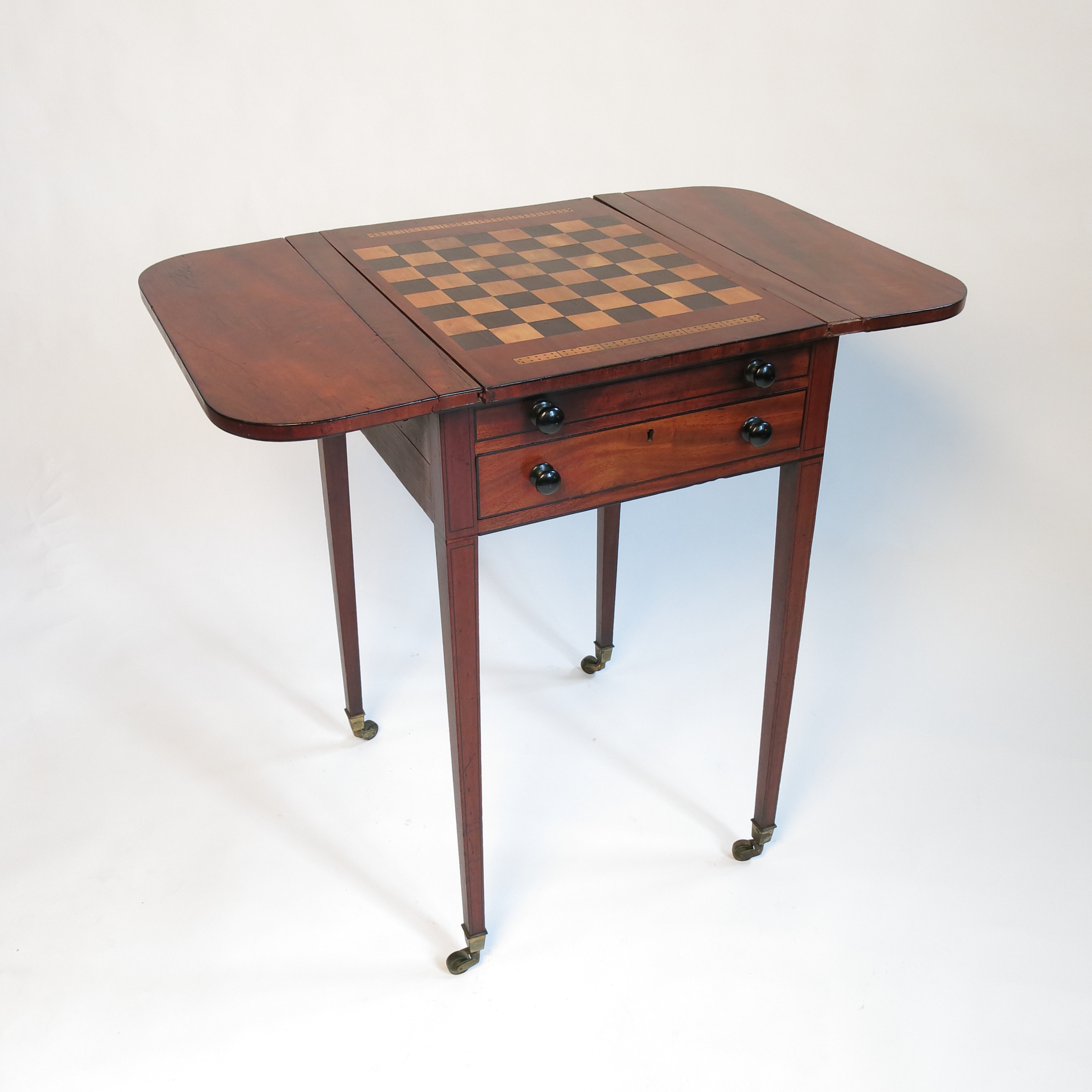 A late Georgian mahogany Pembroke games table, the slide out reversible top with draughts board, - Image 4 of 4