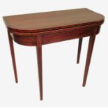 A late Georgian mahogany D shaped fold over tea table, with broad crossbanded top,