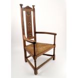 An Edwardian rush seated open armchair,