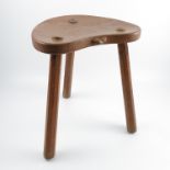 An oak cricket stool, by Robert Mouseman Thompson, with kidney shaped seat,