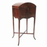 A mahogany dome top work table, with rising lid fitted with two drawers below,