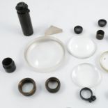 An assortment of various telescope and binocular lenses,