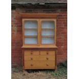 A 19th century light oak cabinet,