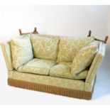 A knoll style two seater sofa, with drop ends and green floral upholstery,