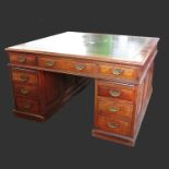 A 19th century mahogany double sided partners desk, fitted with drawers and cupboards,