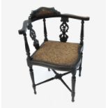 An Edwardian ebonised corner chair, with marquetry and bone line inlay,