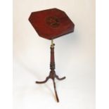 A Victorian mahogany music stand, with adjustable brass column and ratchet slope,