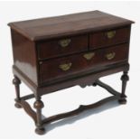 An 18th century low chest,