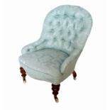 A 19th century grandmother's chair with deep button back,