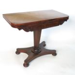 A 19th century rosewood fold over games table, with carved frieze,