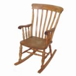 An elm seated Windsor rocking chair,