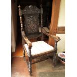 A set of ten Jacobean oak dining chairs, with carved panel backs, dated 1625,