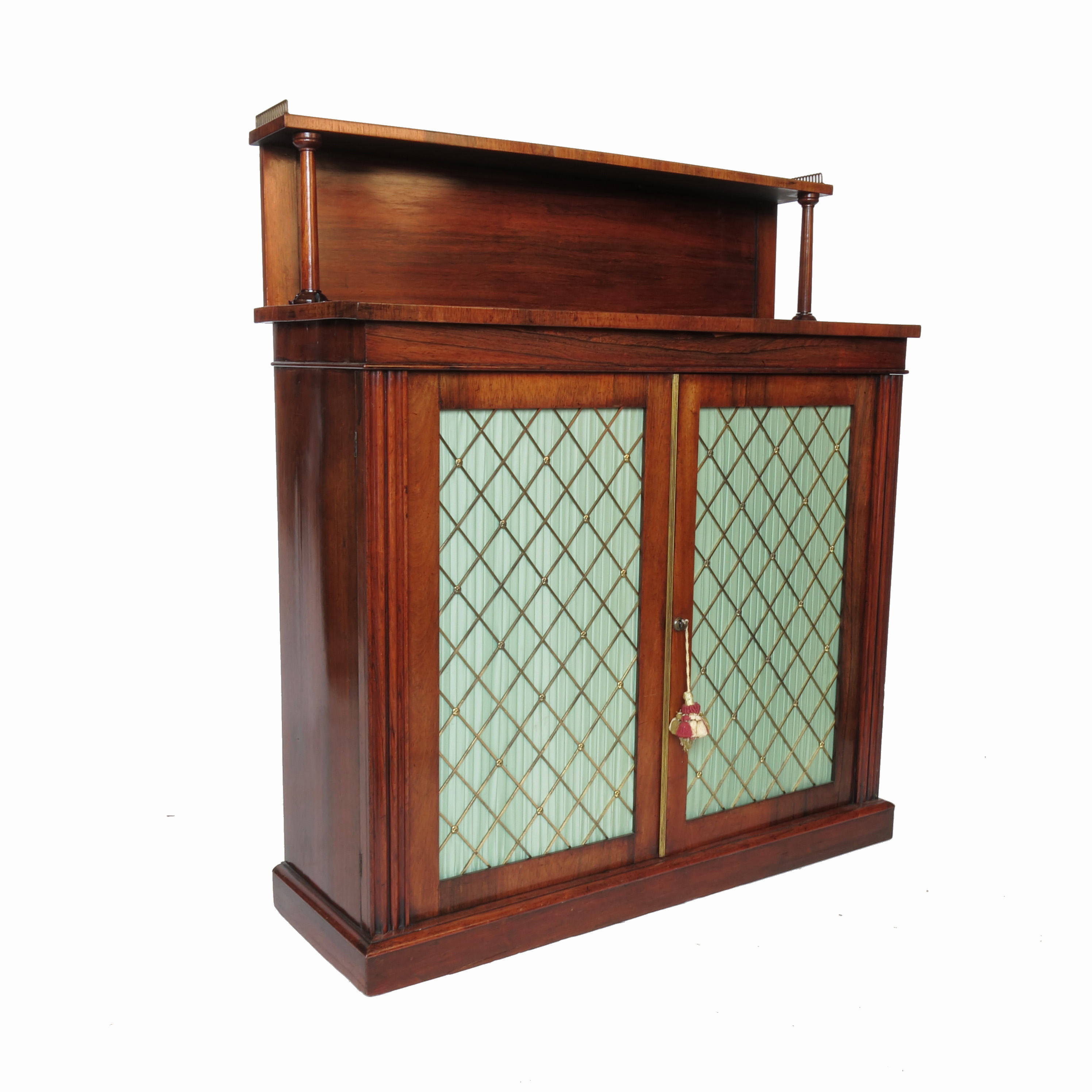 A 19th century rosewood chiffonier, with a galleried shelf over and two doors with brass grills,