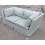 A two seater sofa together with matching armchair,