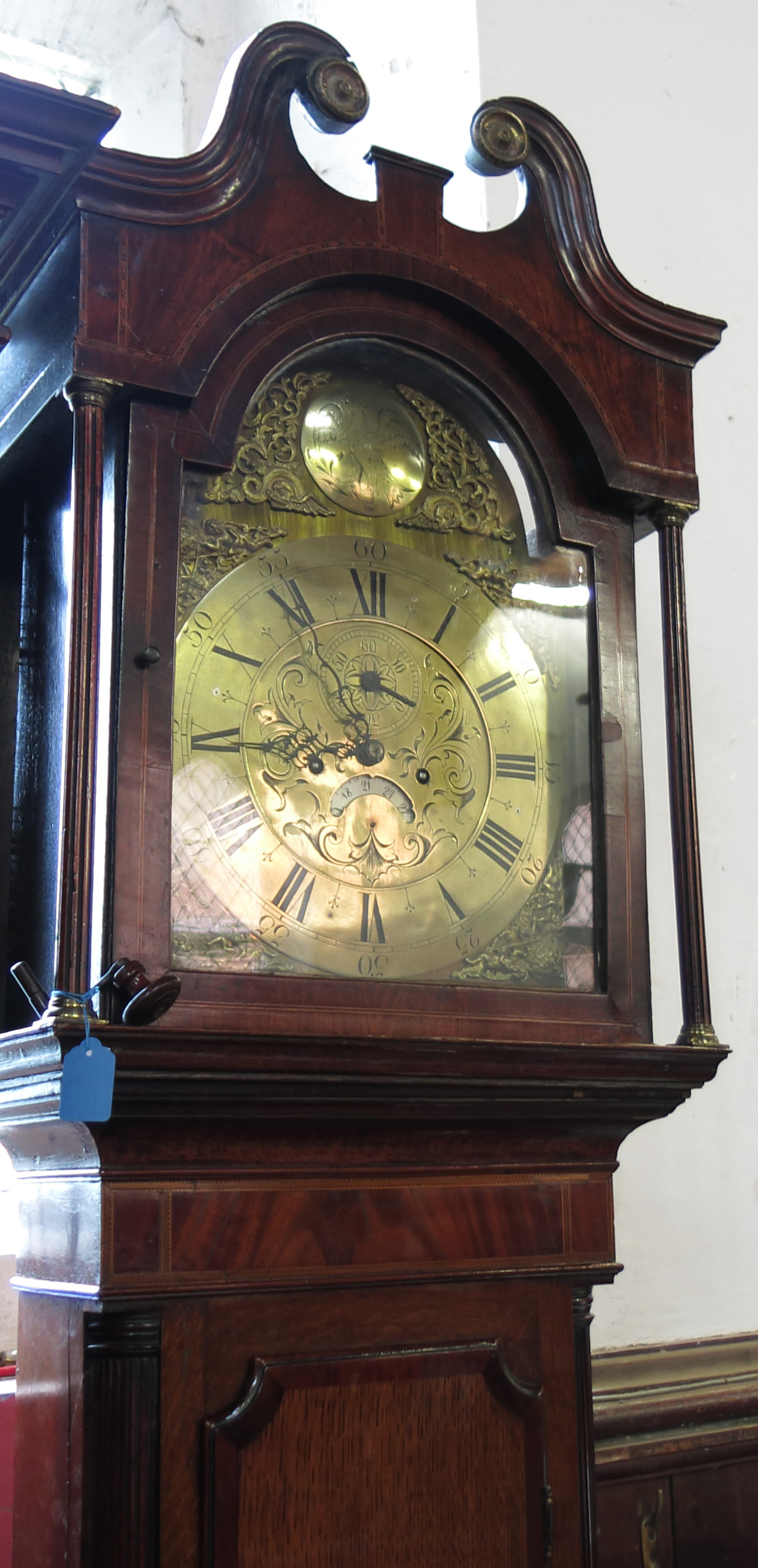 A 19th century long case clock, having a brass dome topped dial,