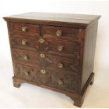 A 17th century style oak chest, of two short over three long drawers, with moulded front decoration,