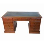 An Edwardian oak pedestal desk,